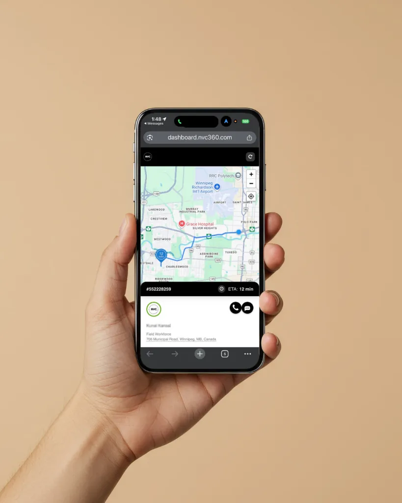 A hand holds a phone showing a customer tracking page with a live map, the technician's route and a 12-minute ETA